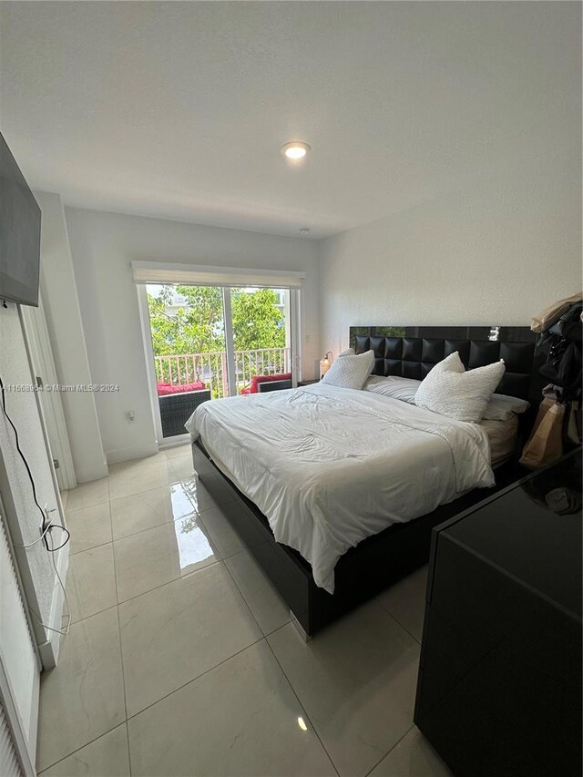 bedroom with light tile patterned floors