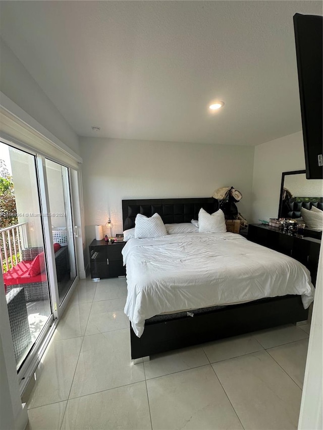 bedroom featuring access to outside and light tile patterned floors