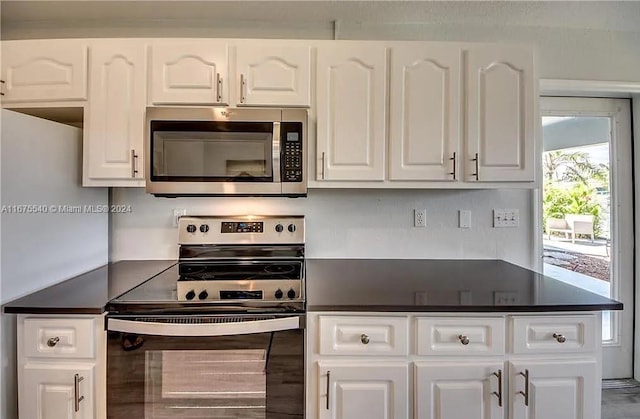 kitchen with white cabinetry and stainless steel appliances