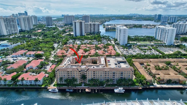 bird's eye view featuring a water view and a view of city