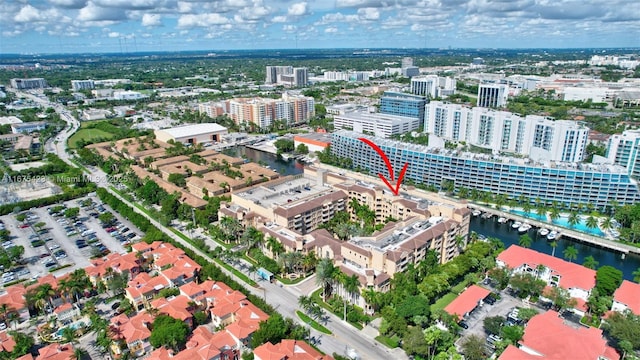 drone / aerial view featuring a water view and a view of city