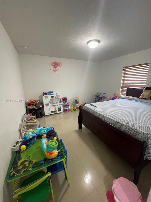 bedroom featuring a textured ceiling