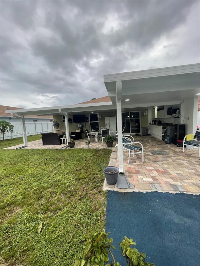 exterior space with a patio and a yard