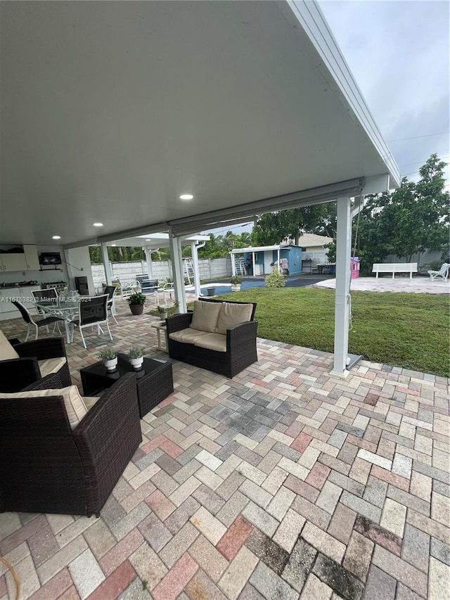 1369 Rainbow Ave, Palm Beach, FL 33406 - view of patio featuring an outdoor living space and an outdoor structure