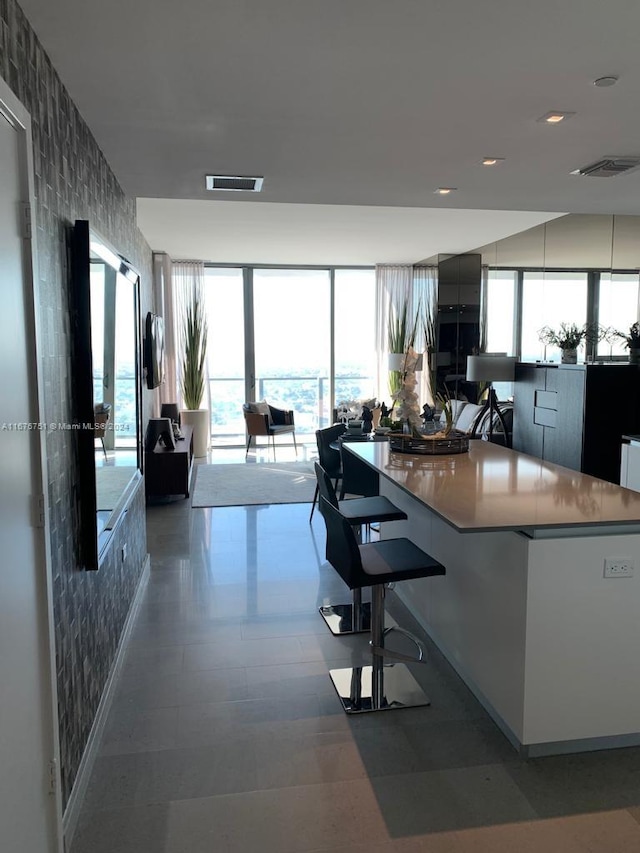 kitchen with tile patterned floors and a large island