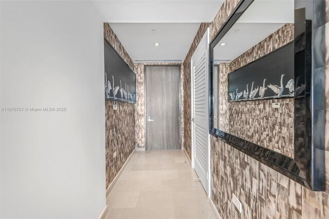 88 SW 7th St Unit 3806, Miami, FL 33130 - kitchen with modern cabinets, stainless steel microwave, a kitchen island, white cabinets, and recessed lighting