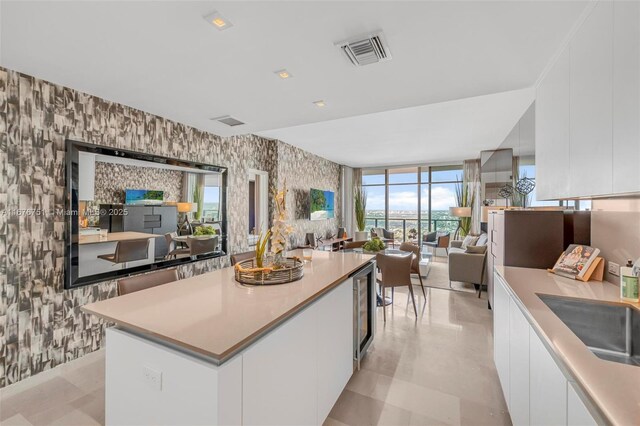 88 SW 7th St Unit 3806, Miami, FL 33130 - bathroom with a bathtub, toilet, tile walls, double vanity, and tile patterned floors