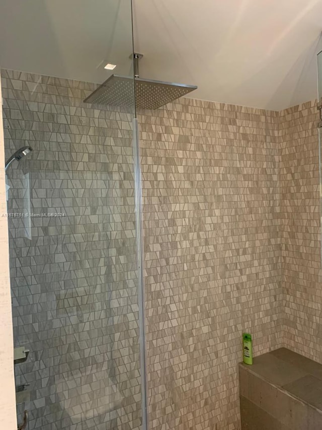 bathroom with tiled shower