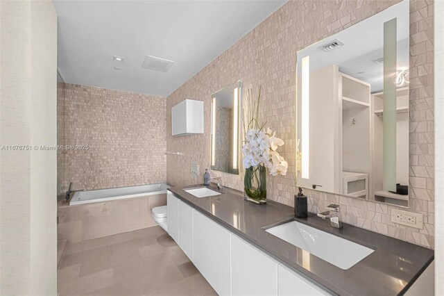 88 SW 7th St Unit 3806, Miami, FL 33130 - clothes washing area with stacked washer / dryer