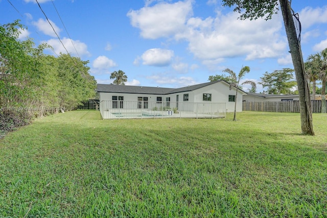 back of house with a yard