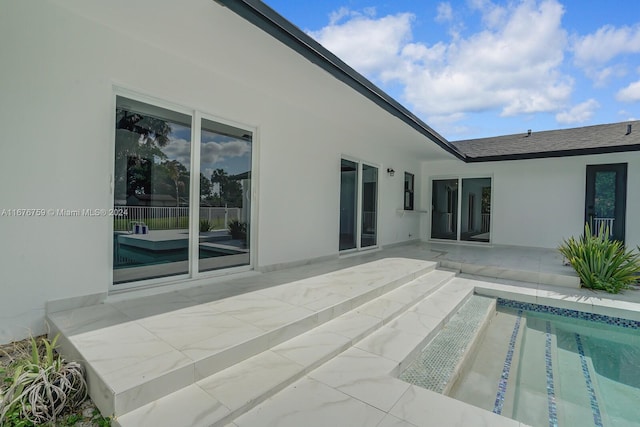 view of swimming pool featuring a patio