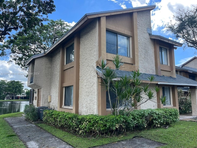 view of home's exterior with a yard