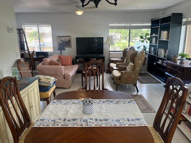 tiled living room with ceiling fan