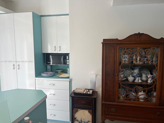 interior space featuring white cabinetry