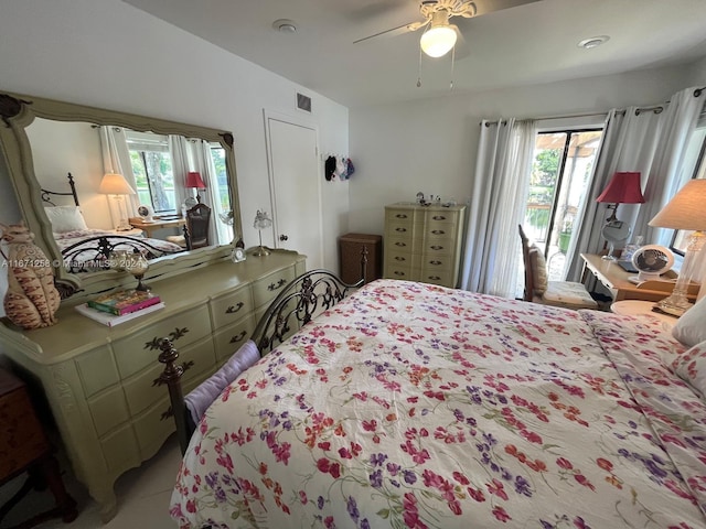 bedroom featuring ceiling fan and multiple windows