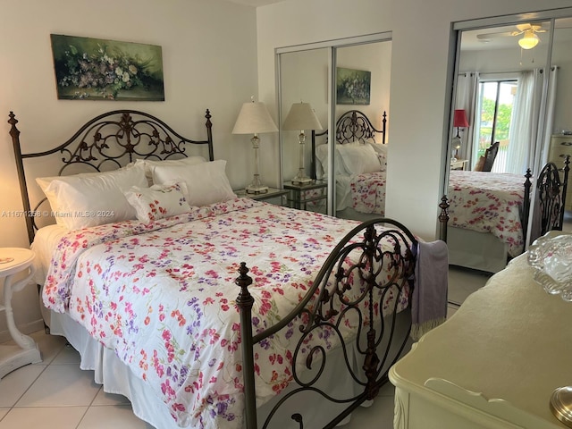 tiled bedroom featuring a closet and ceiling fan