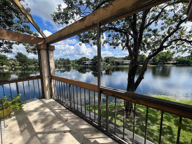 balcony featuring a water view