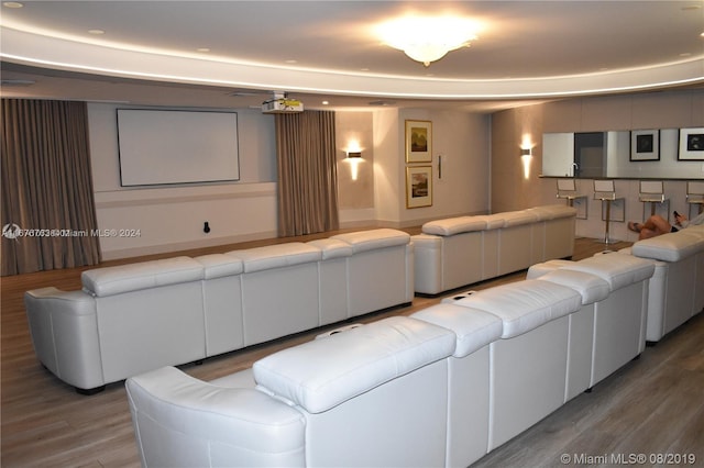 home theater room with hardwood / wood-style floors