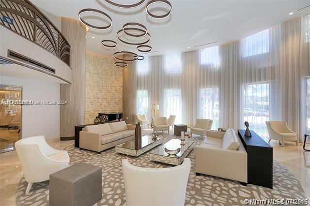 living room featuring a stone fireplace