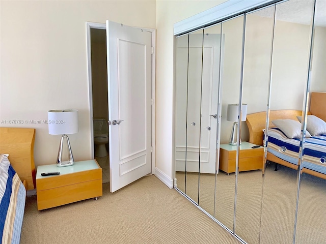 carpeted bedroom featuring a closet