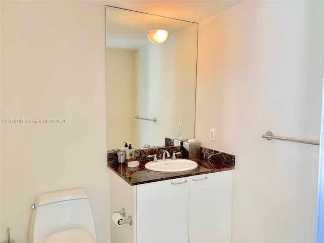 bathroom with vanity and toilet