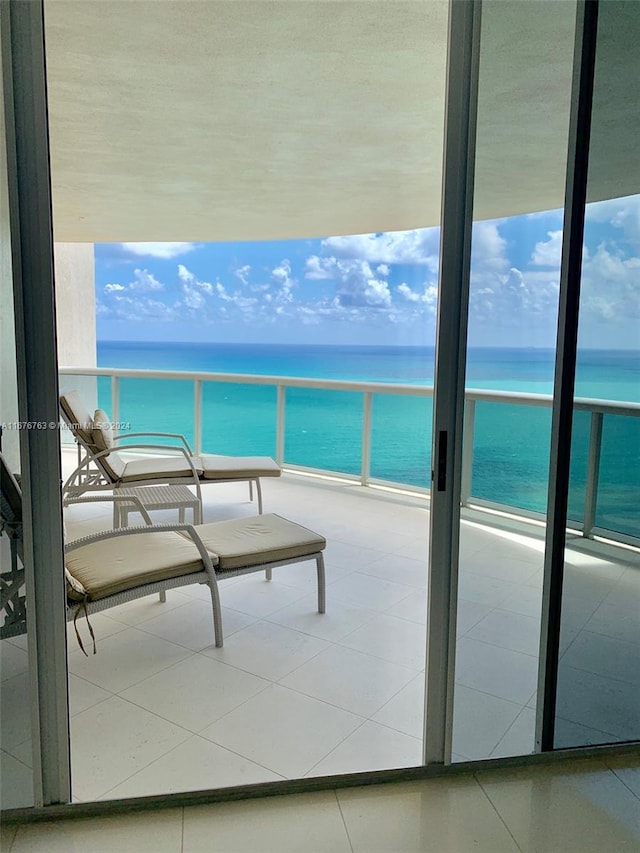 balcony with a view of the beach and a water view