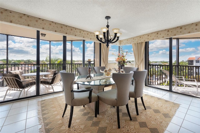 sunroom featuring an inviting chandelier and a wealth of natural light