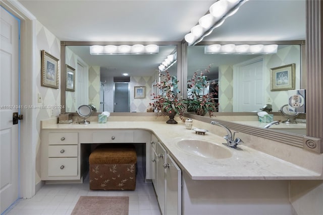 bathroom with vanity, a shower with shower door, and tile patterned flooring