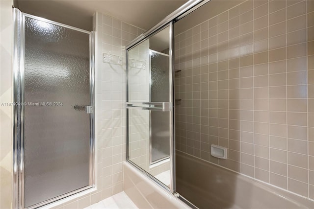 bathroom featuring enclosed tub / shower combo