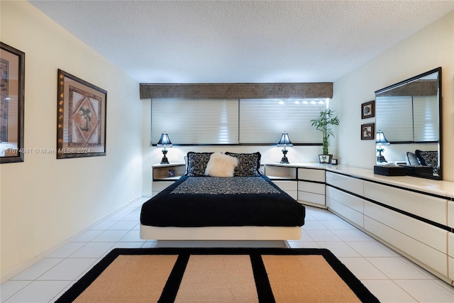 tiled bedroom featuring a textured ceiling