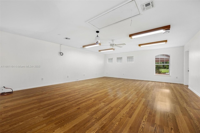 spare room featuring hardwood / wood-style floors and ceiling fan