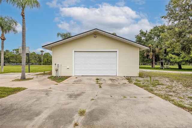 garage featuring a yard