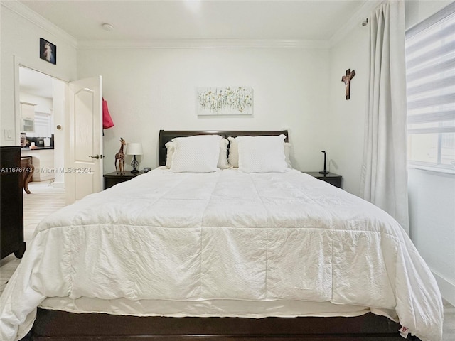 bedroom with ornamental molding