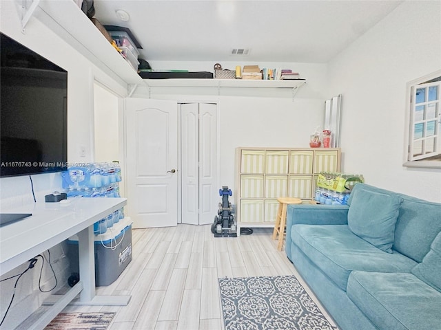 interior space featuring light hardwood / wood-style flooring and a closet