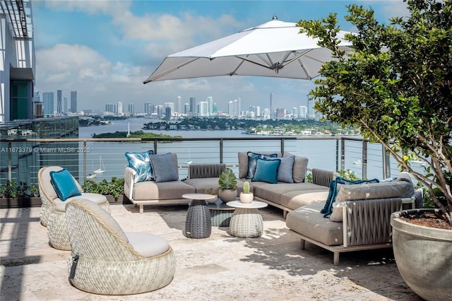 view of patio / terrace with a balcony and an outdoor hangout area