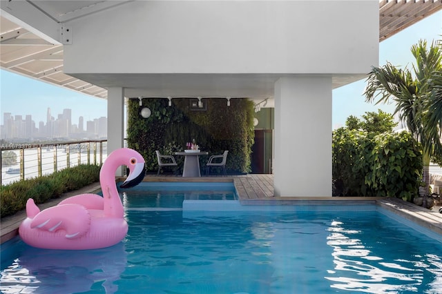 outdoor pool with a city view