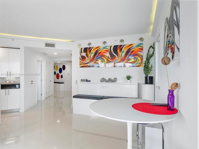 dining area with tile patterned flooring and visible vents