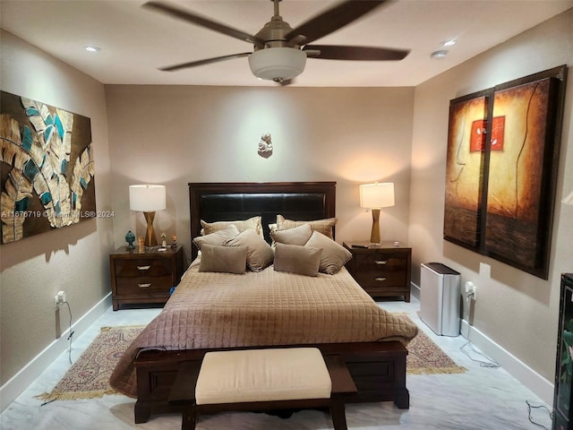 bedroom with ceiling fan and light carpet