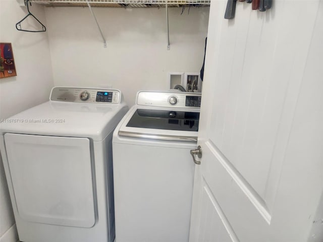 laundry room with washer and dryer