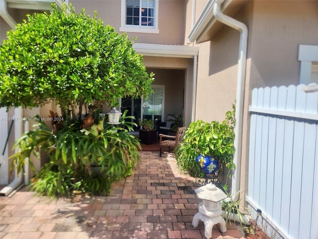 entrance to property with a patio area