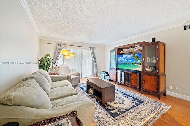 living room with crown molding, a textured ceiling, and light hardwood / wood-style flooring