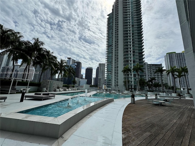 view of pool with a jacuzzi