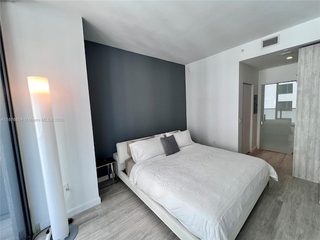 bedroom featuring light hardwood / wood-style floors