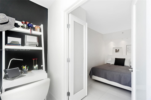 bedroom with light tile patterned floors