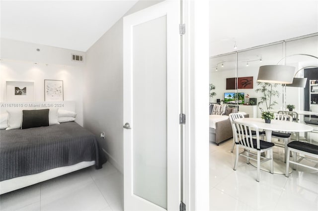 100 Lincoln Rd Unit 1201, Miami Beach, FL 33139 - bedroom featuring light tile patterned flooring and vaulted ceiling