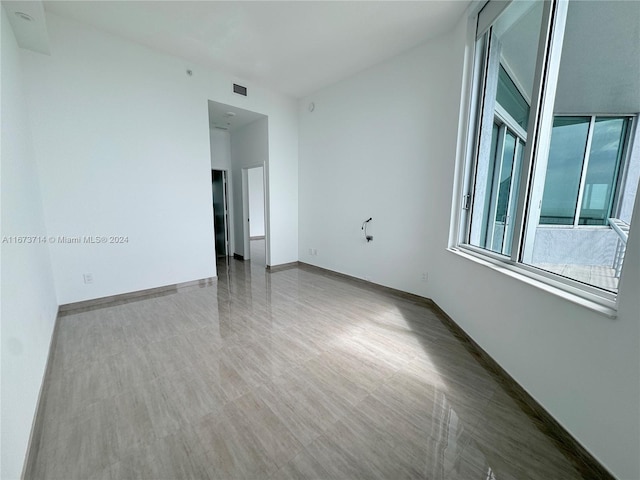 unfurnished room featuring wood-type flooring