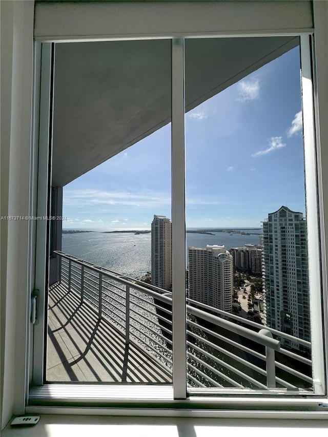 balcony featuring a water view