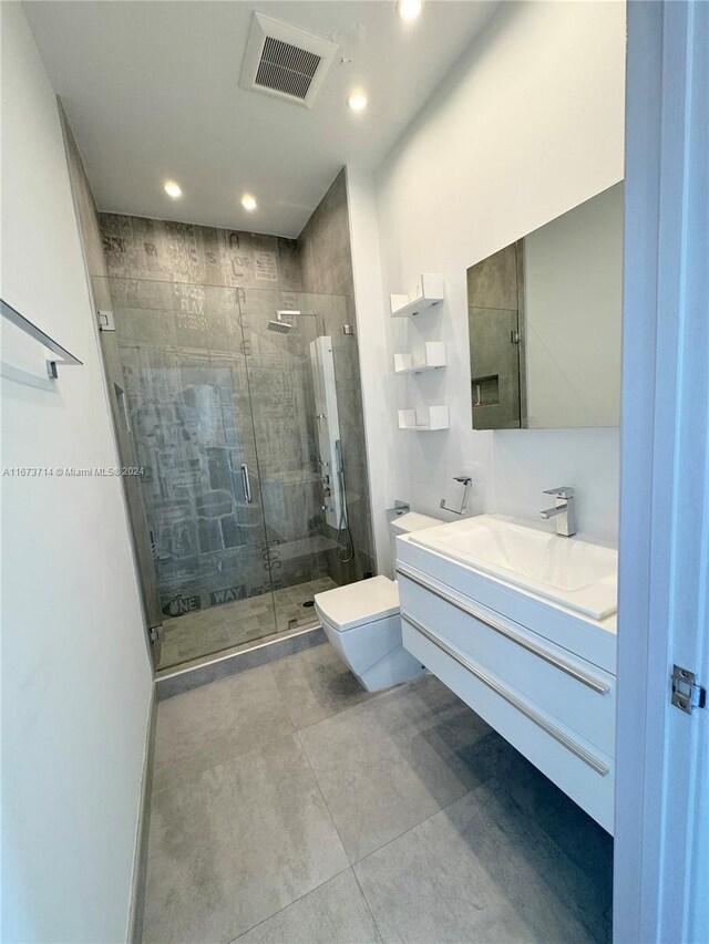 325 S Biscayne Blvd Unit 19, Miami, FL 33131 - bathroom with recessed lighting, vanity, a stall shower, and toilet
