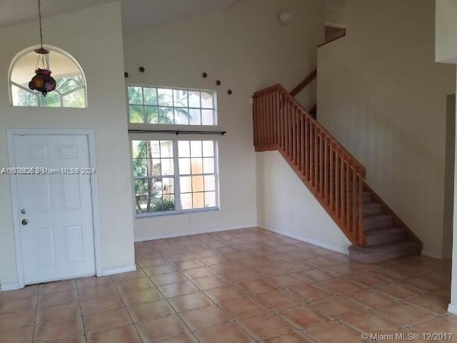 entryway with a high ceiling