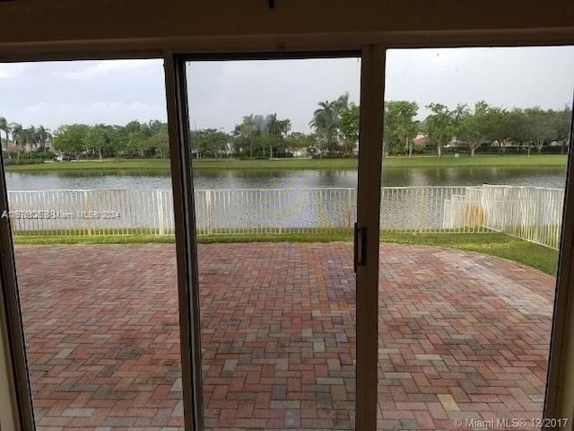 view of patio featuring a water view